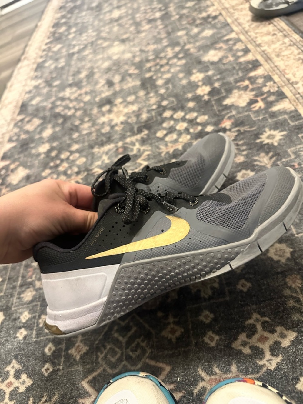 Nike Kids/Women’s Gray and Black Metcon with Gold Swoosh